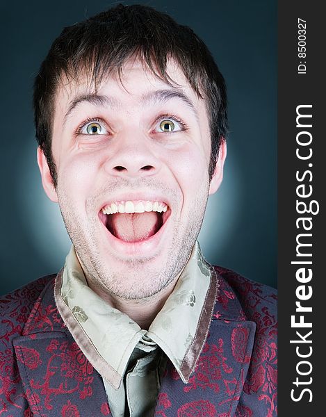 Funny young man, studio shot