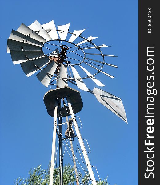 A windmill for pumping water in the country. A windmill for pumping water in the country