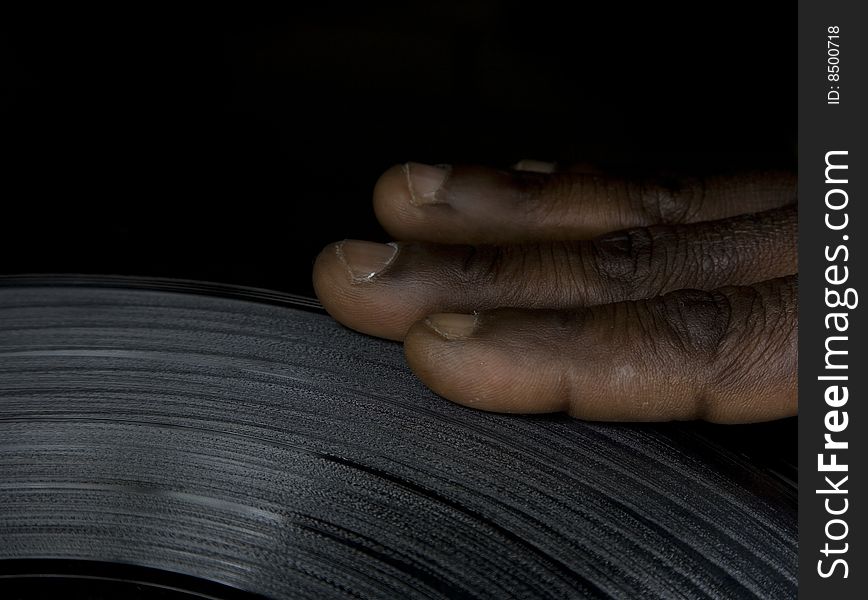 Close up of a hand on the lp. Close up of a hand on the lp