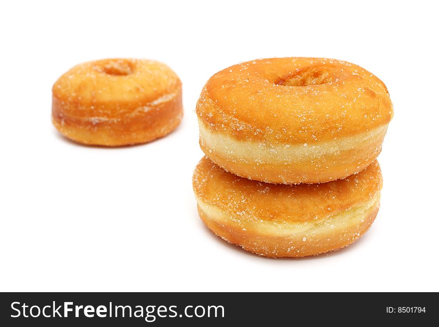 Three sweet donuts isolated on white background.