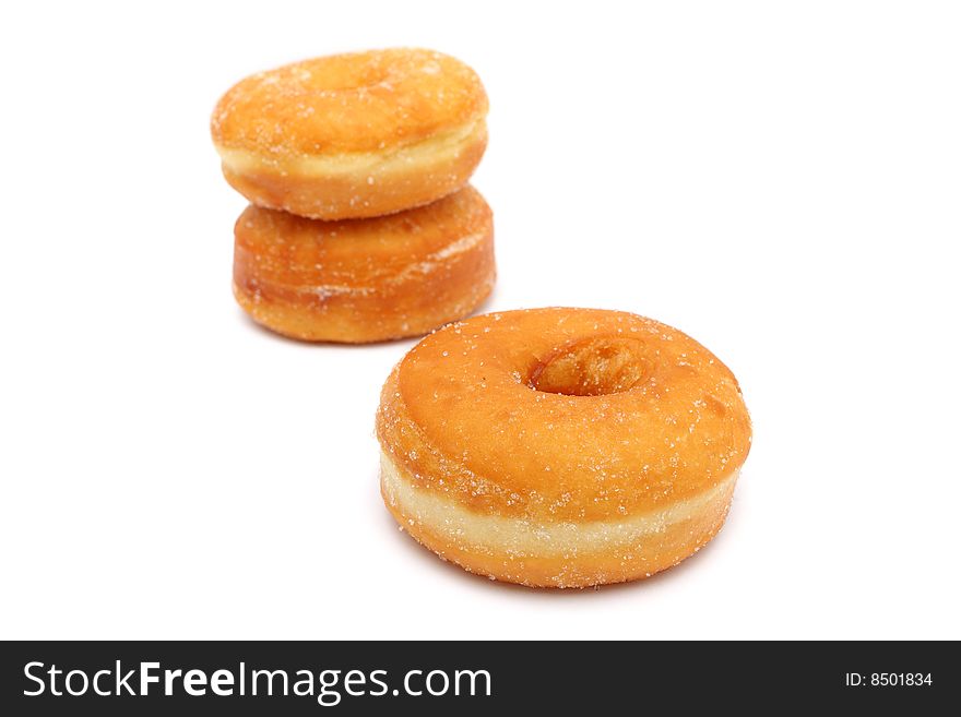 Three sweet donuts isolated on white background.