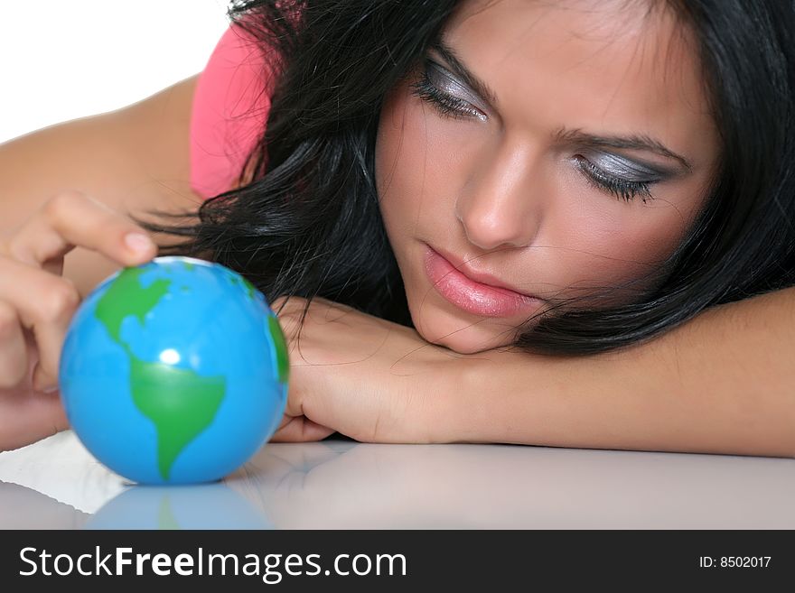 Beautiful girl and small globes, isolated on a white background. Beautiful girl and small globes, isolated on a white background