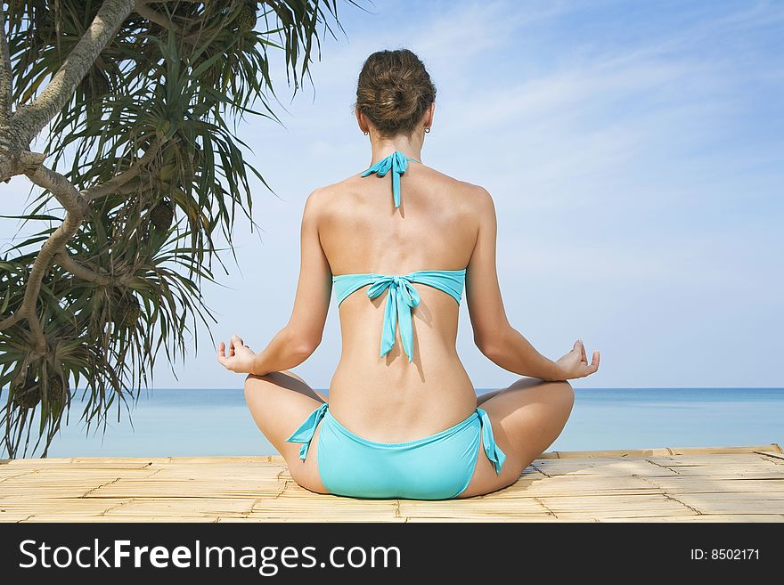 Portrait of young woman practicing yoga in summer environment. Portrait of young woman practicing yoga in summer environment