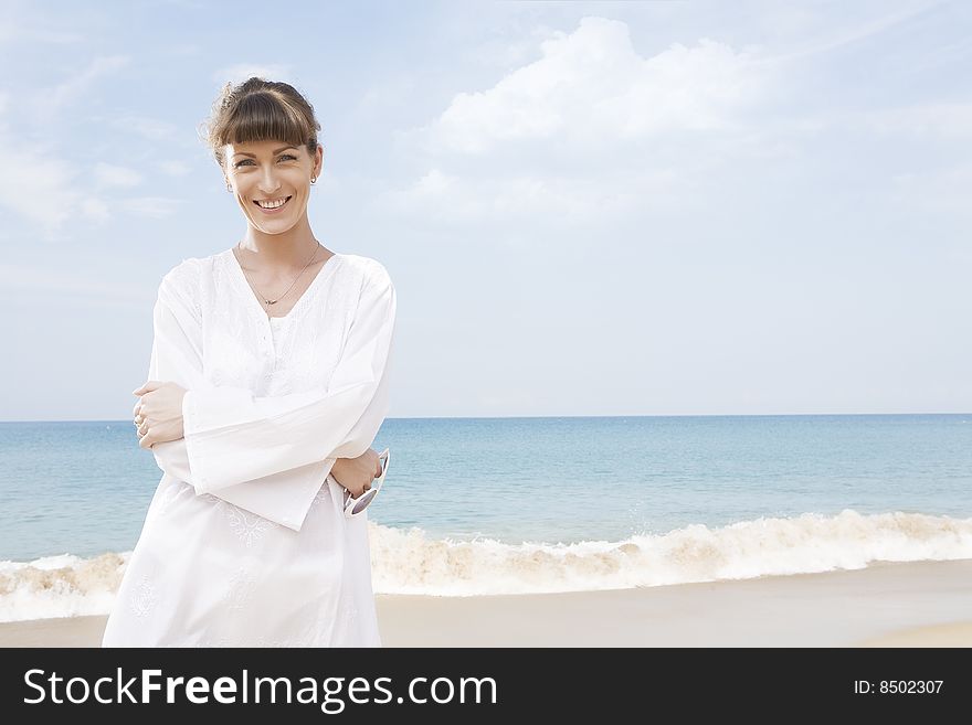 Portrait of nice young woman having good time on the beach. Portrait of nice young woman having good time on the beach