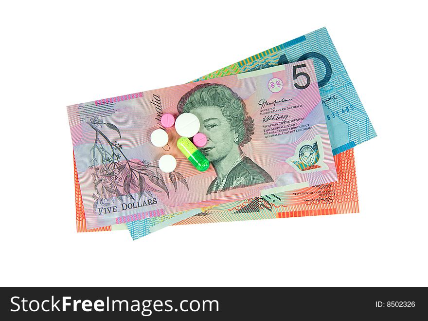 Assortment of pills on top of australian dollar bills. Assortment of pills on top of australian dollar bills