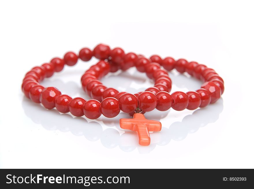 Red coral necklace, white background