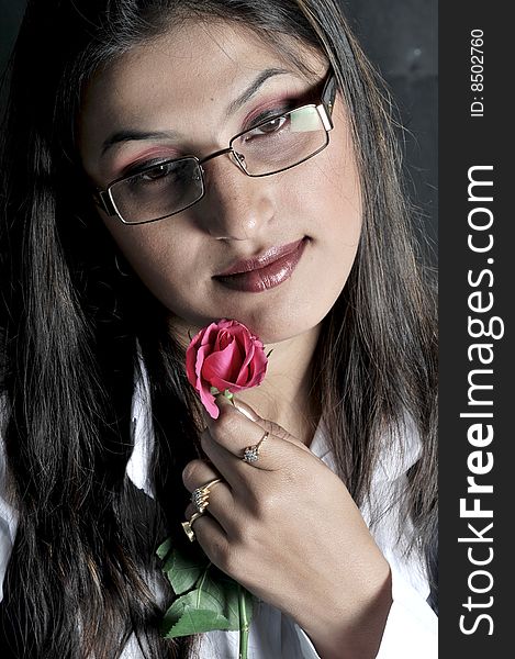 Girl with rose in studio.