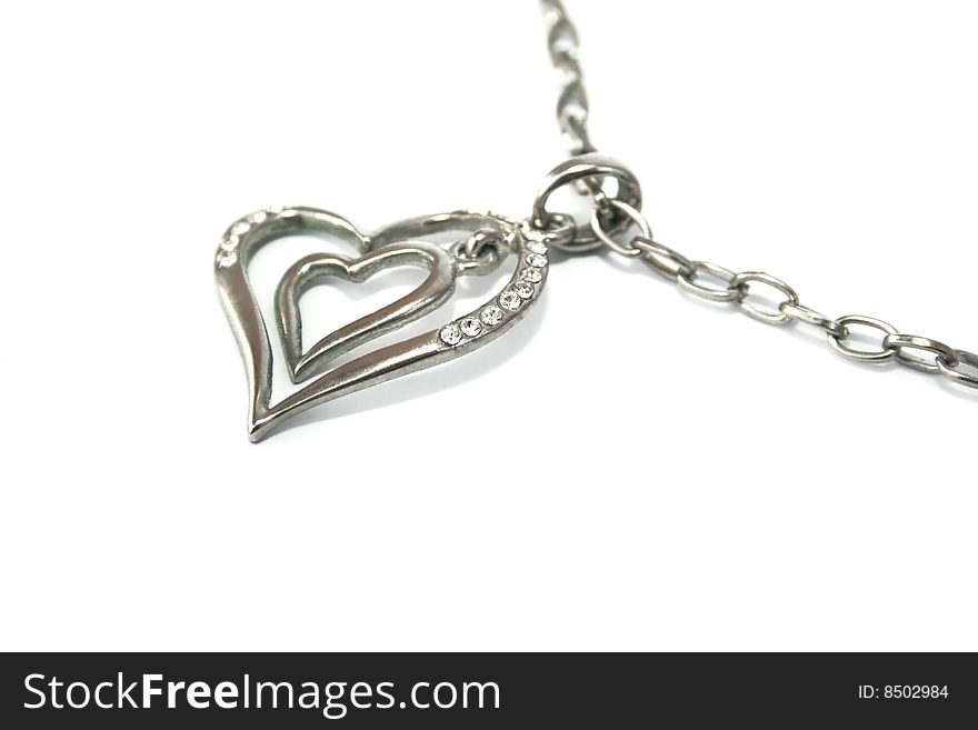Two hearts necklace isolated on white background.