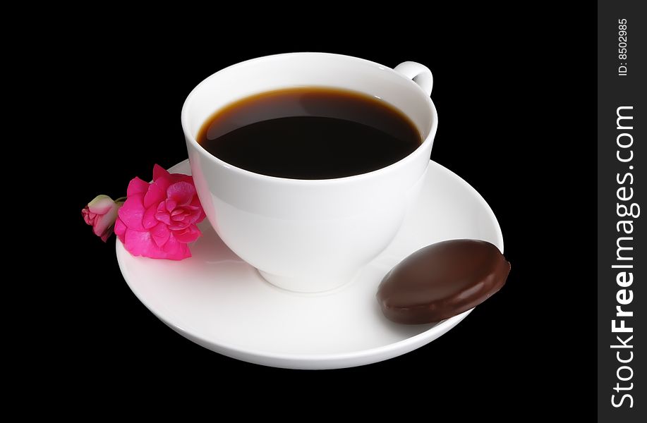 Coffee cup with chocolate biscuit and pink flower isolated on black. Coffee cup with chocolate biscuit and pink flower isolated on black