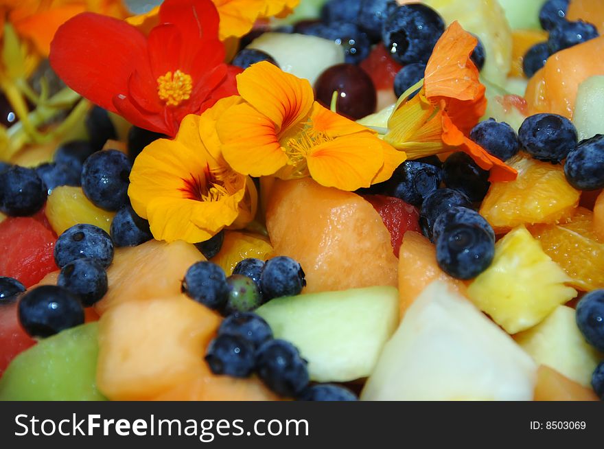 Fruit salad with nasturtium petals