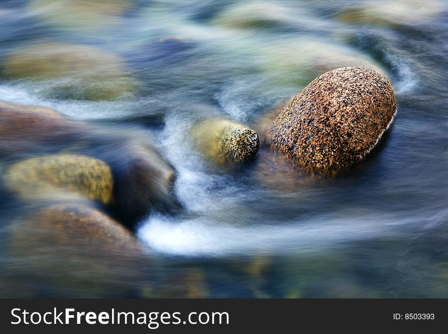 River with calm water and stone. River with calm water and stone