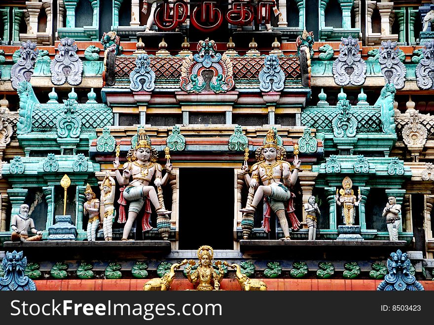 A wealth of finely carved figures cover the ornate Sikhara entrance tower to the 1859-1983 Thendayuthapani Hindu Temple on Tank Road in Singapore - Lee Snider Photo. A wealth of finely carved figures cover the ornate Sikhara entrance tower to the 1859-1983 Thendayuthapani Hindu Temple on Tank Road in Singapore - Lee Snider Photo.