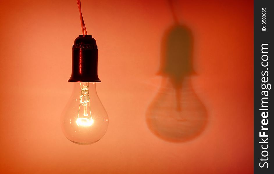 Photo of light bulb on red background