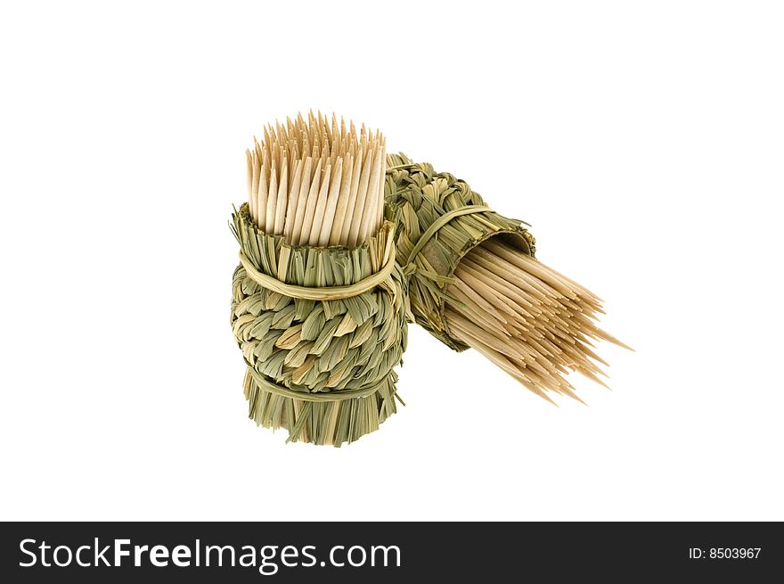 Bamboo toothpicks in a wum basket isolated on a white background