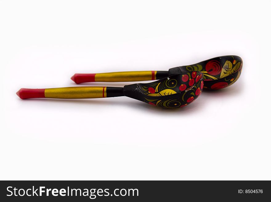 Two wooden spoons isolated on a white background.