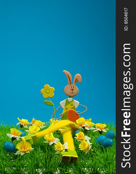 Cute easter bunny with on grass in spring