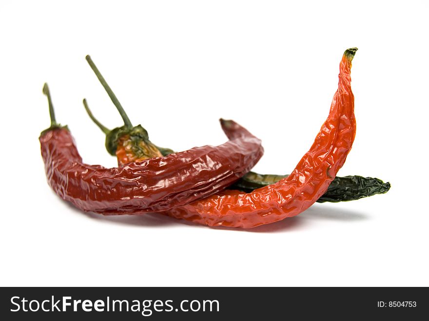 Dried red chili peppers isolated on white background. Dried red chili peppers isolated on white background