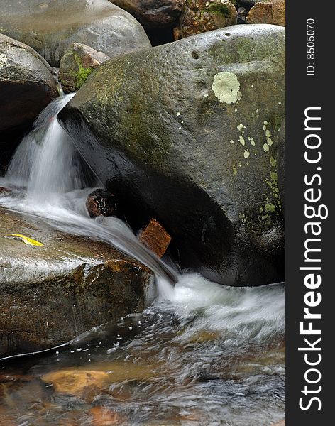 Beautiful stream waterfall bouncing through rocks