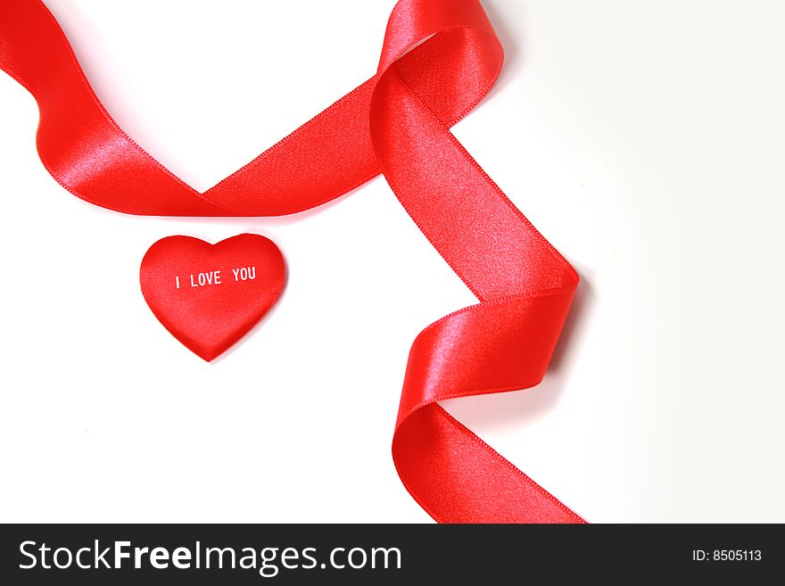 Read heart and red ribbon on white it is isolated. Read heart and red ribbon on white it is isolated