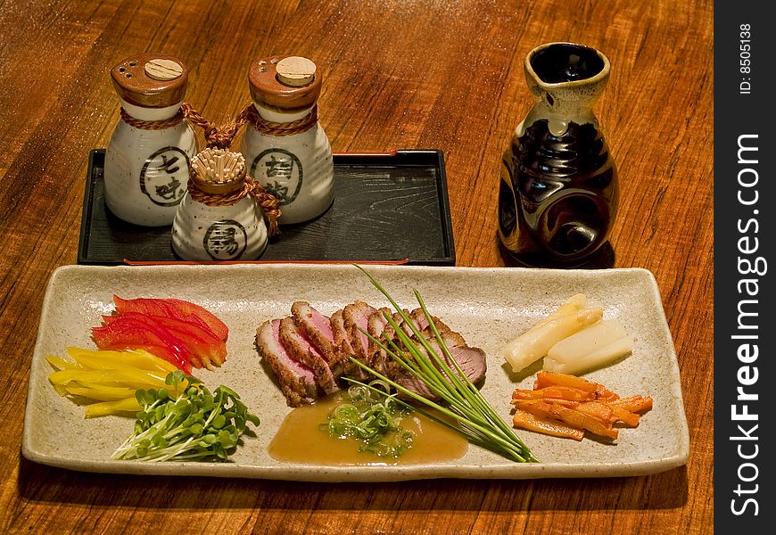 Delicious Japanese dish stalled on a table in a Japanese restaurant. Delicious Japanese dish stalled on a table in a Japanese restaurant