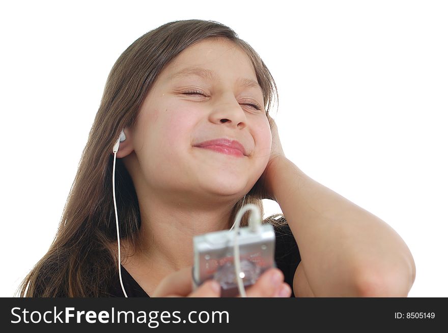 The little cute girl listen the music(holding the pleer )