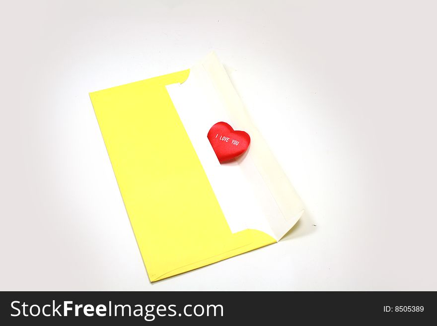 Yellow paper envelope with white red heart. Yellow paper envelope with white red heart