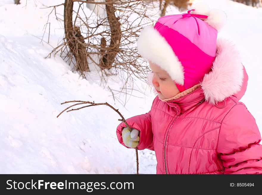 Pretty Little Girl Drawing On The Snow.