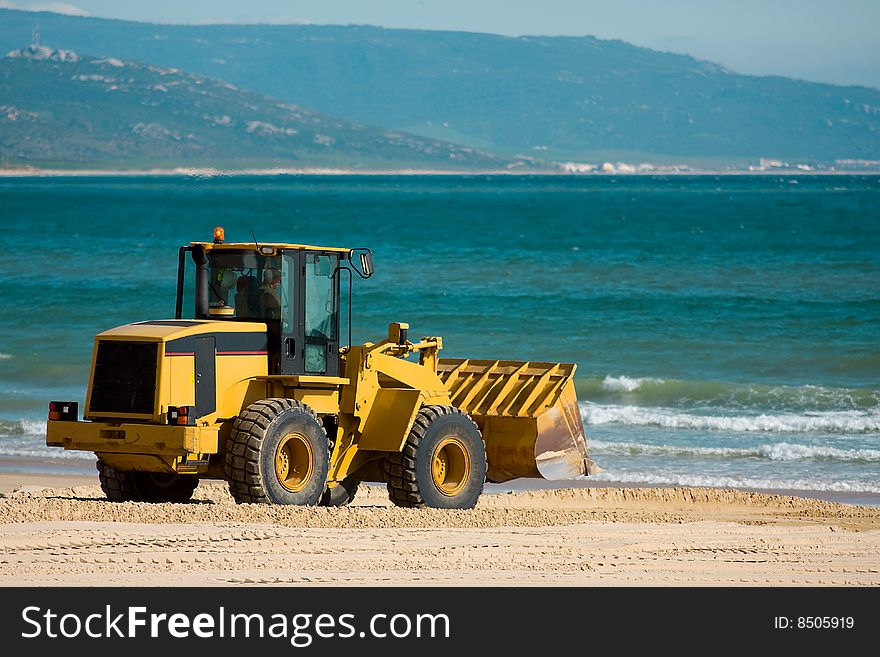 Articulated Digger takes a vacation on a Spanish Beach