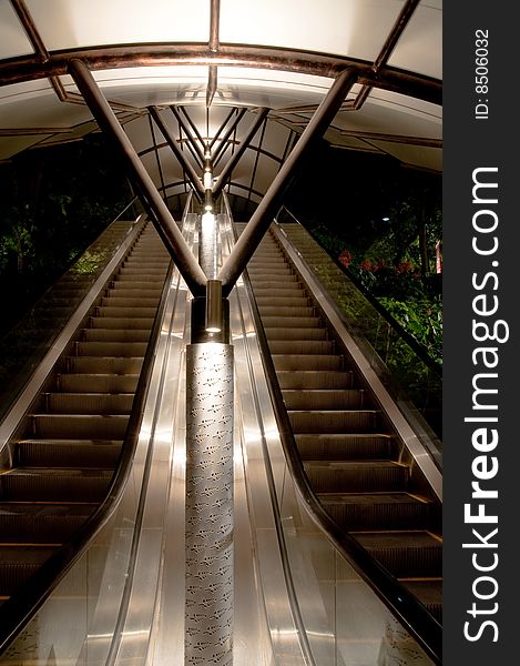 Well lit sheltered escalators at night