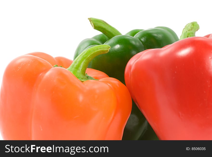 Close up on colorful paprika on white background. Close up on colorful paprika on white background