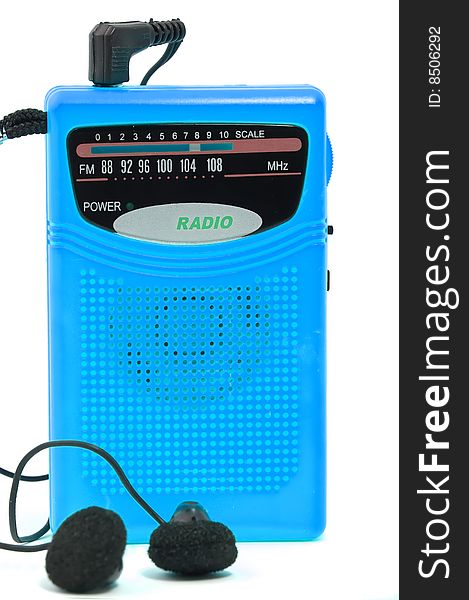 Close up on blue retro radio with headphones on white background