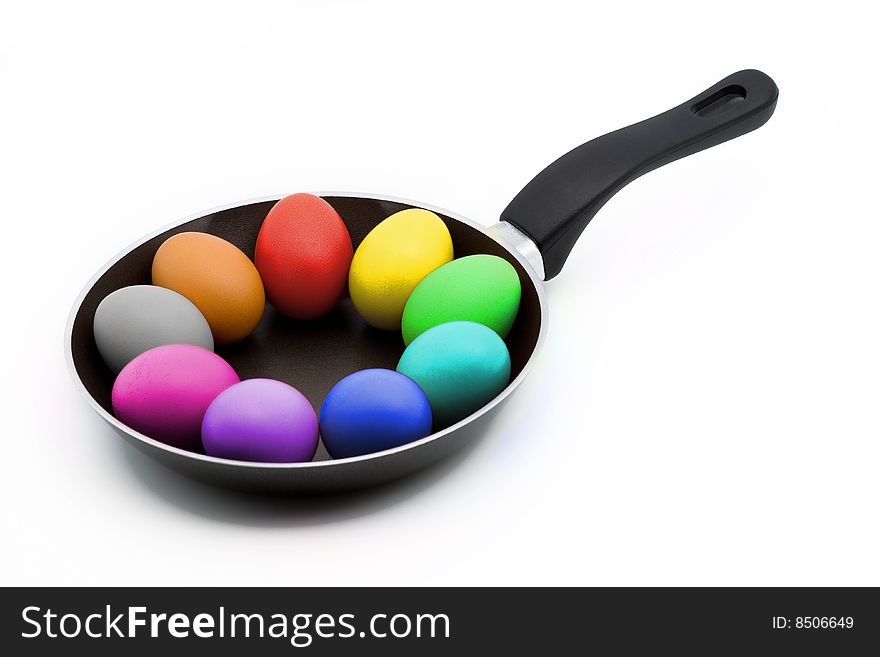 Colorful easter eggs in a pan isolated on white