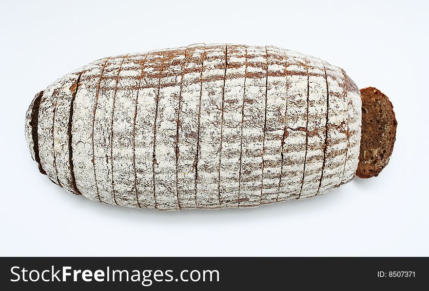 Sliced loaf of cereal bread on white background