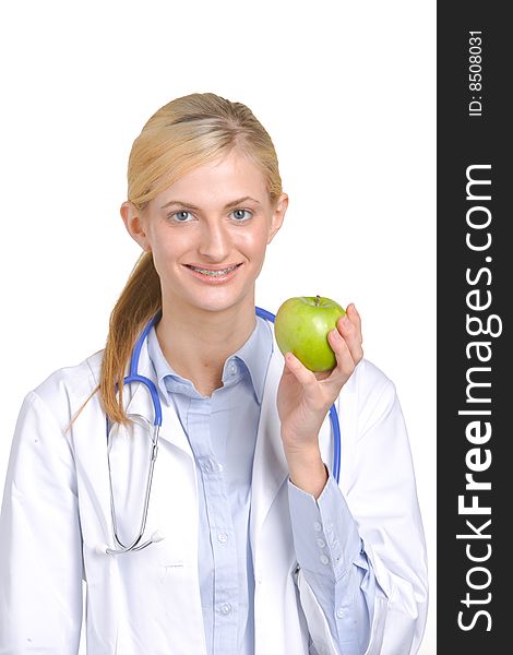 Woman doctor holding an apple isolated on white