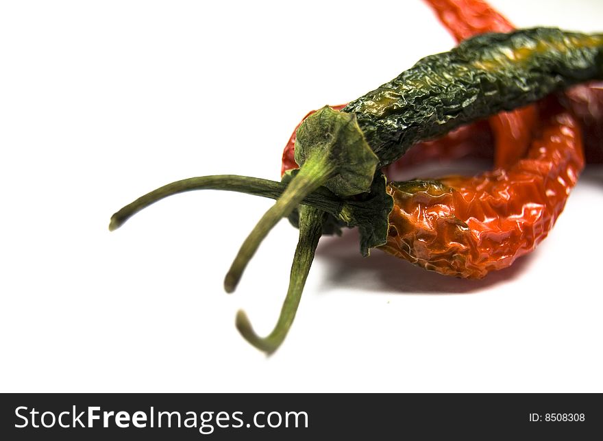 Large dried chillies isolated on white background