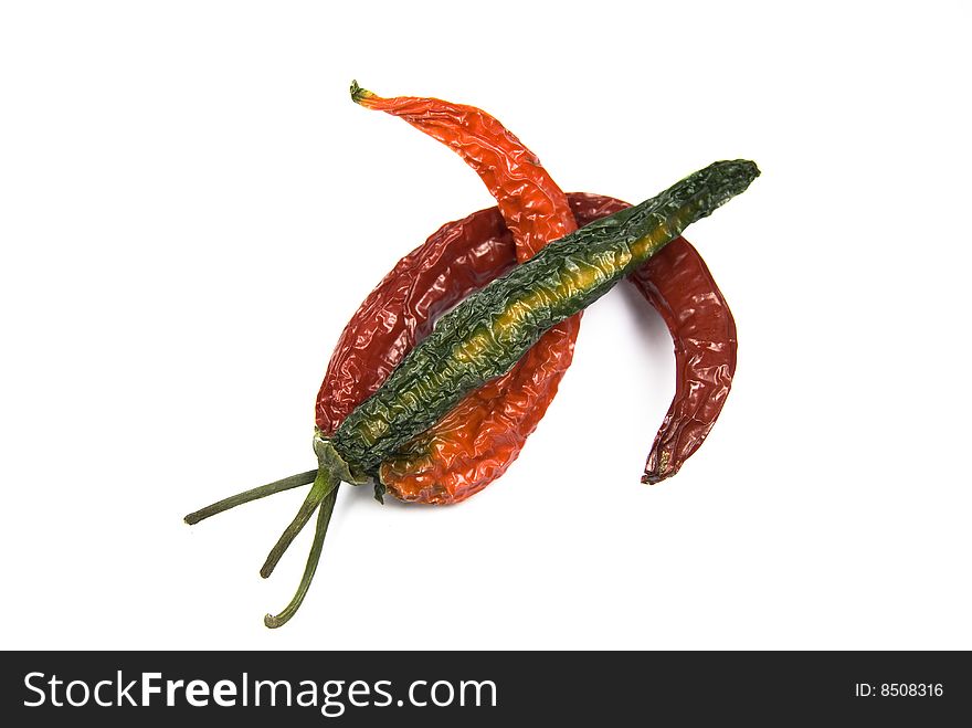 Dried colorful chillies isolated on white background