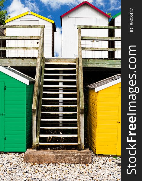 A group of colorful seaside beach huts