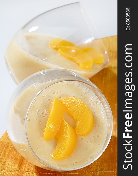 Yogurt with peach fruit in glass