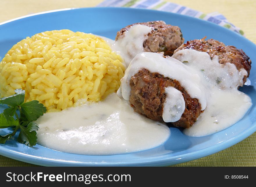 Rice with meat balls and sauce