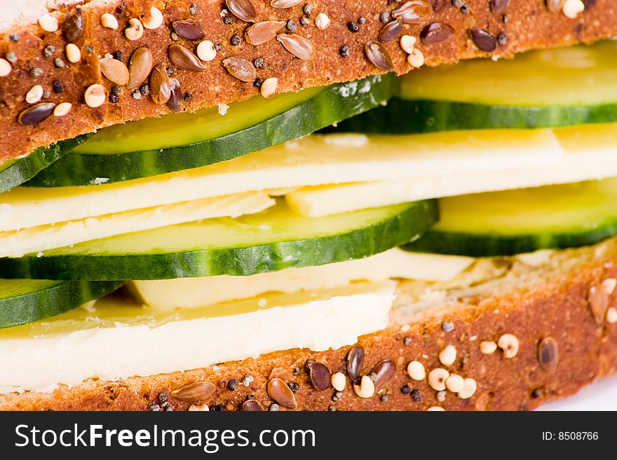 Macro of cheese and cucumber sandwich wholegrain bread. Macro of cheese and cucumber sandwich wholegrain bread