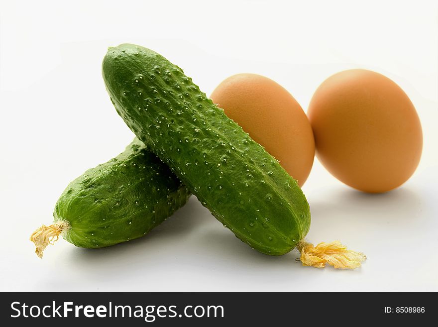 Cucumbers and eggs jn white background. Cucumbers and eggs jn white background