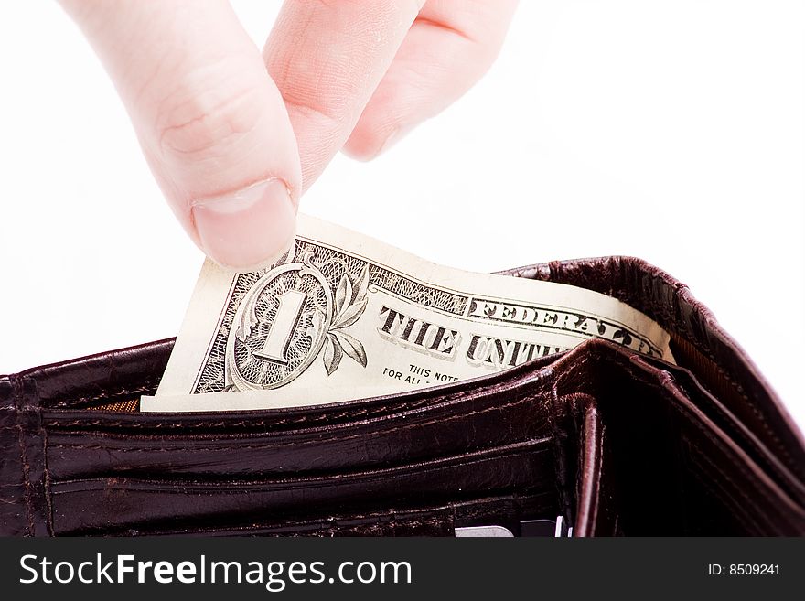 Hand picking dollar bill from a wallet. Hand picking dollar bill from a wallet