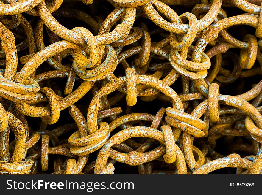 Detail of collection of rusty chain links. Detail of collection of rusty chain links