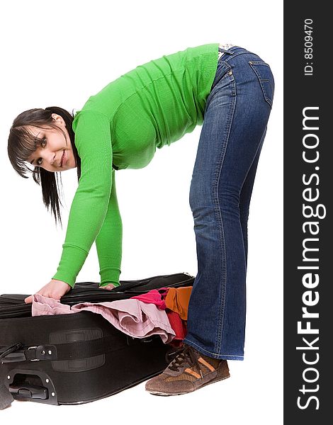 Woman packs her clothes. over white background. Woman packs her clothes. over white background