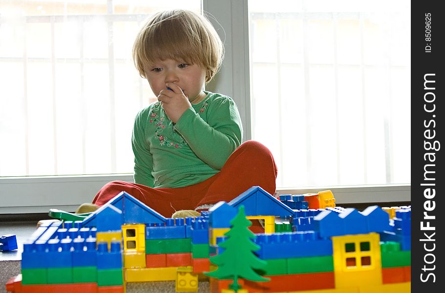 Sweet toddler baby girl playing at home. Sweet toddler baby girl playing at home