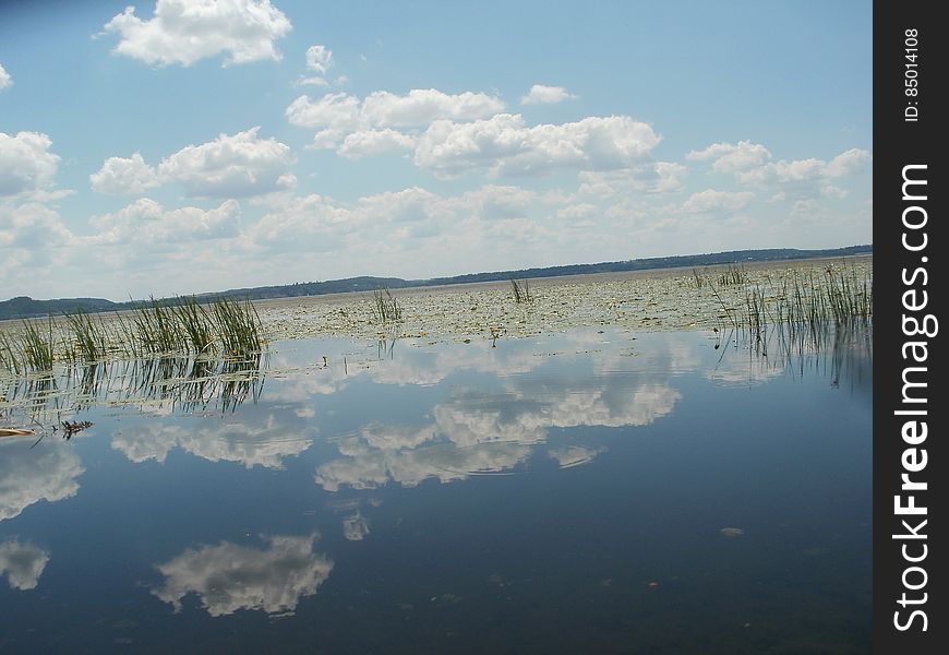 Beautiful Floating Clouds in the Blue Sky. Water is like a mirror. Beautiful Floating Clouds in the Blue Sky. Water is like a mirror.