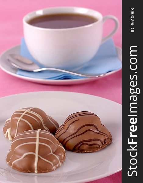 Tea and biscuits on a pink background. Tea and biscuits on a pink background