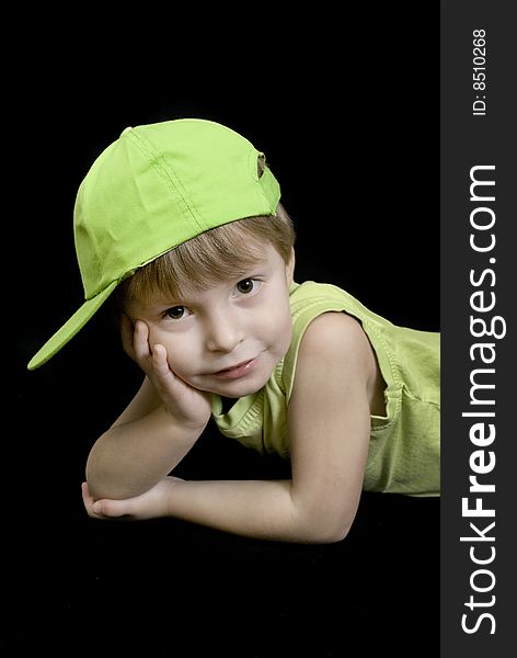 A portrait of a cute three year old boy wearing a hat andmatching top. A portrait of a cute three year old boy wearing a hat andmatching top.