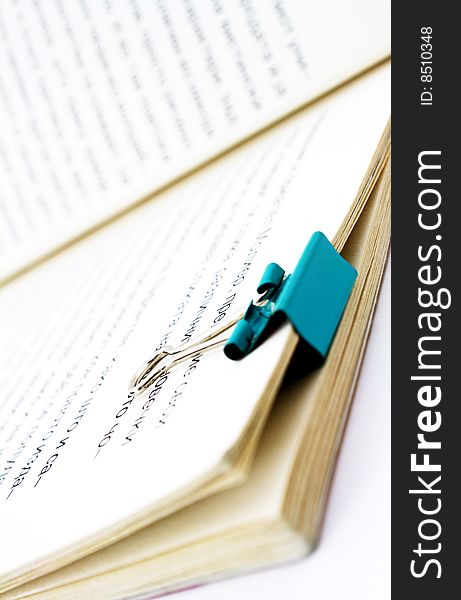 Book with paper clip isolated on white