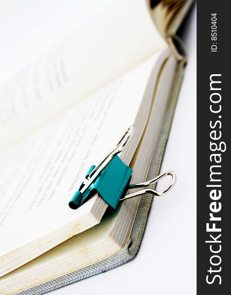 Book with paper clip isolated on white